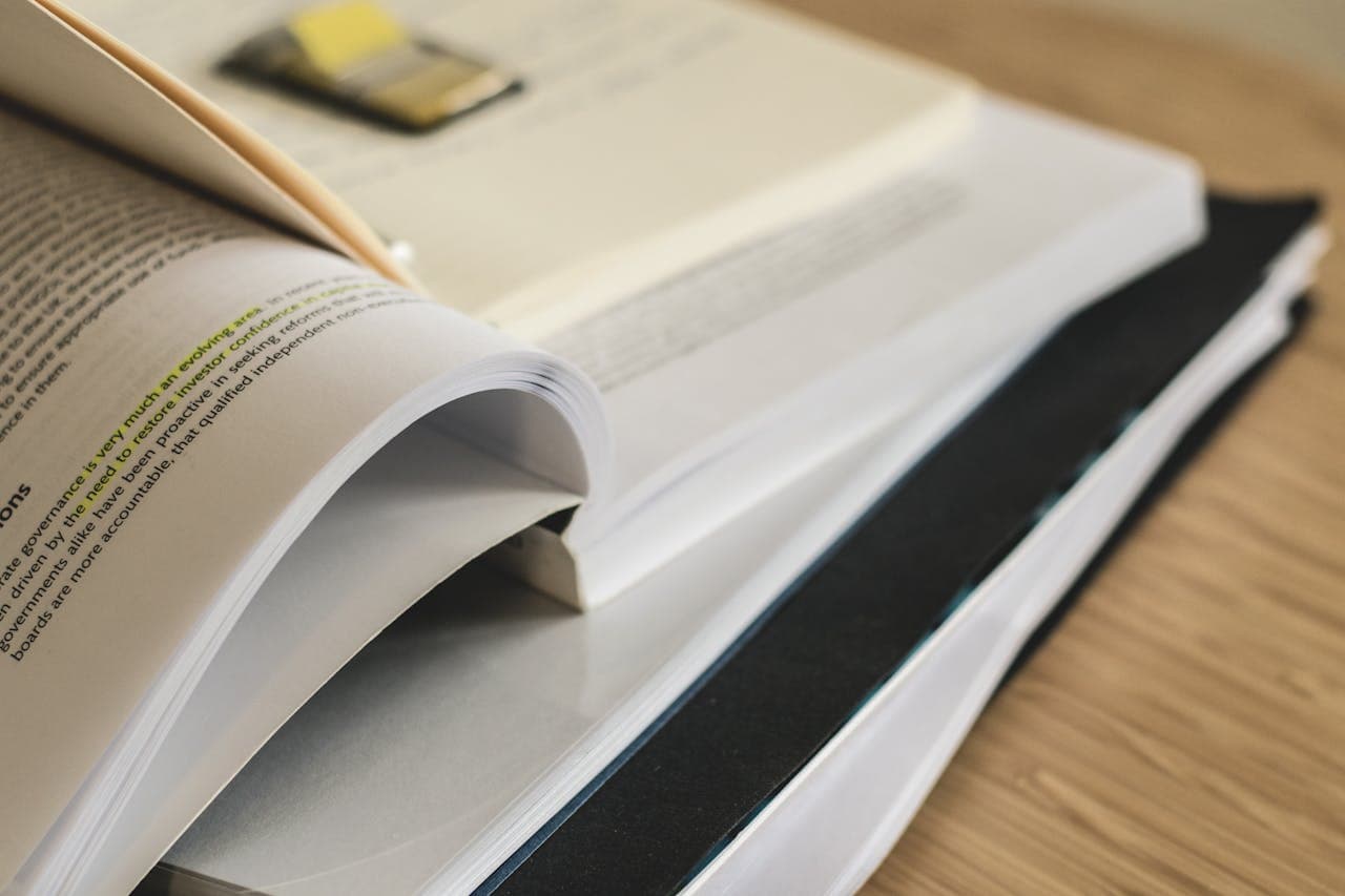 Close-up of open textbook on a desk